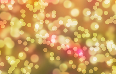 Obraz premium christmas bokeh background in yellow and gold