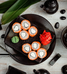 salmon sushi with cream served with ginger and wasabi