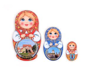 Souvenir (magnet) from Belarus in the form of dolls isolated on white background. Belarusian inscription does the name 