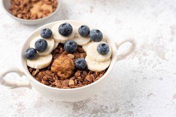 Granola, oatmeal with banana food background