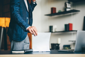 Businessman working on modern loft office.