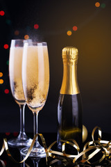 Two Glasses of Champagne against Blurred Christmas Lights. Shallow Depth of Field.