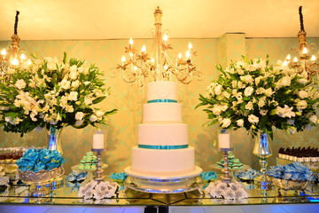 birthday cake with flowers, 15 years birthday cake in the party hall, condensed milk candy balls, candy balls	