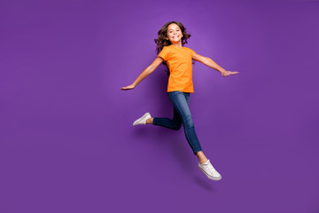 Fototapeta na wymiar Full length body size view of her she nice attractive lovely cute cheerful cheery wavy-haired girl jumping having fun time isolated over lilac purple violet pastel color background