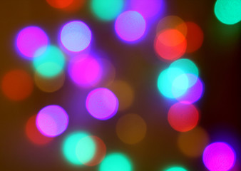 Colorful bokeh lights on black background On christmas day.
