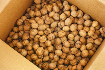 Heap of walnuts in a cardboard box