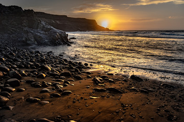 costa mar atardecer acantilado piedras