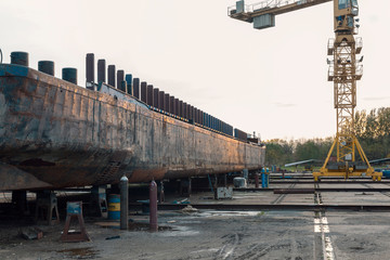 ship yard with rusty ship