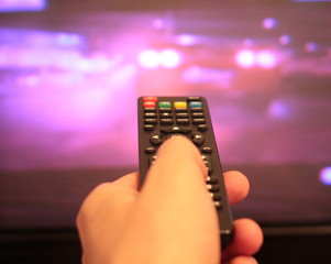The remote control is aimed at the TV.