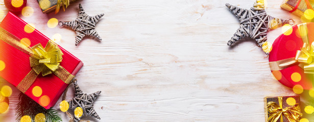 Christmas decor and gift boxes on the wooden table. Christmas or New Year holiday background.