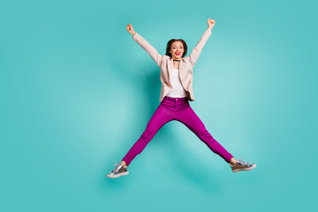 Fototapeta na wymiar Full length body size view of her she nice-looking attractive pretty cheerful cheery girl jumping having fun free time isolated on bright vivid shine vibrant blue green turquoise color background
