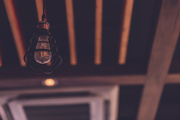 Tungsten light bulb Very hanging from the ceiling, vintage tone