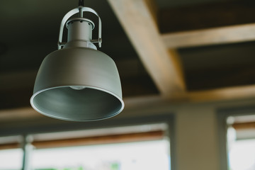 Gray lamp shade with tungsten bulb