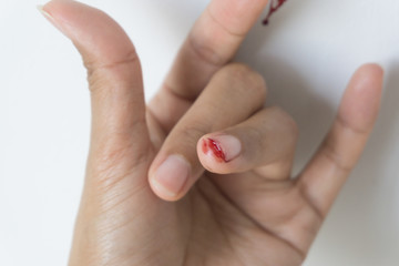Red blood from finger, Fingers making the I Love You symbol.