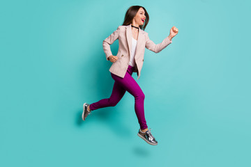 Fototapeta na wymiar Full length body size profile side view of nice attractive cheerful cheery sportive straight-haired girl jumping running isolated on bright vivid shine vibrant blue green turquoise color background