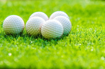 golf ball on green grass with copy space