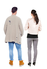 Fototapeta premium Back view of couple. beautiful friendly girl and guy together.
