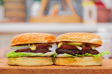 two homemade hamburgers with vegetables