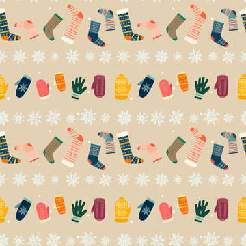 Seamless cozy pattern with warm clothes like socks and mittens and gloves and snowflakes on beige back