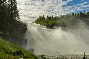 The roaring and misty waterfall Tannforsen in Sweden
