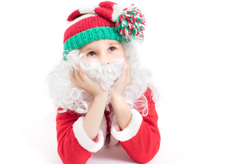 Child Santa Claus in a knitted hat. Christmas boy.Christmas holidays concept