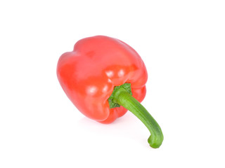 whole fresh red bell pepper with stem on white background