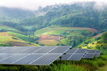 power solar panel on little mountainous village and the mist are beauty on view point background,alternative clean green energy concept