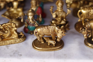 Fototapeta na wymiar Verities of traditionally crafted decoration items with gold colour metal