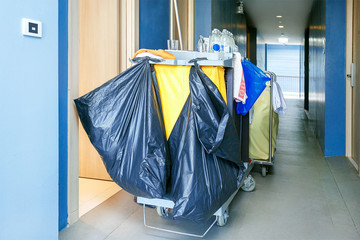Cleaning equipment cart in hotel  corridor. Cleaning In Hotel Room.