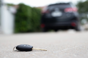 abstract lost car keys fall lying on the street concrete cement ground roadway office front yard....