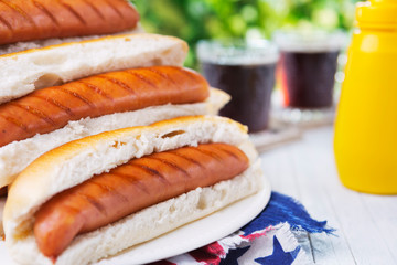 Hot dog on an outdoor table in bright light