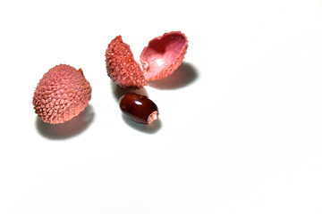 Lychee fruits on a white background