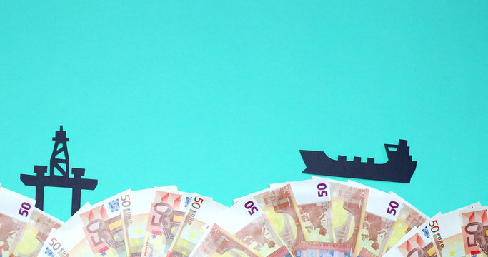 Oil tanker floating against the backdrop of the euro to the oil platform. - Powered by Adobe