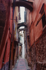 Fototapeta na wymiar Narrow street in Ventimiglia, Liguria, Italy