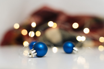 Abstract background with bokeh lights and blue Christmas ball