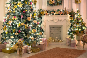 Fototapeta na wymiar Beautiful room with fireplace Christmas tree and garlands.