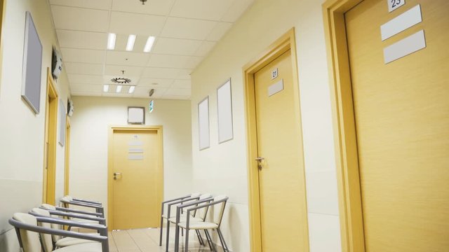 Esthetic and clean modern private clinic or vet waiting room with empty posters