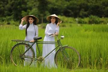 woman in Ao Dai traditional dress of Vietnam.