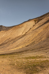 Steep slope of yellow sand mountain, gravel loaf