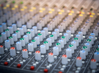 Fototapeta premium Sound equalizer mixing. Professional studio equipment for sound mixing. Music studio image. Close up and selective focus.