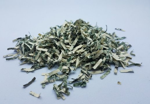 pile of shredded money or dollar bills