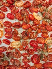 Autumn background with dried tomatoes and herbs