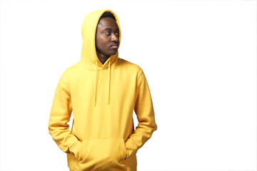 young black man in yellow hoodie