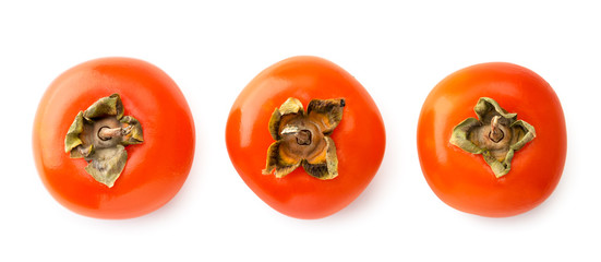 Three ripe persimmons on a white background. The view of top.