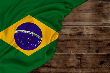color national flag of modern state of Brazil, beautiful silk, background old wood, concept of...