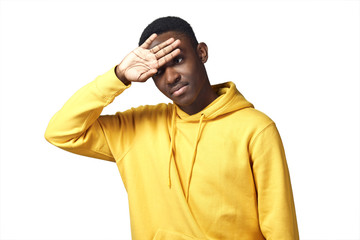 young black man in yellow hoodie