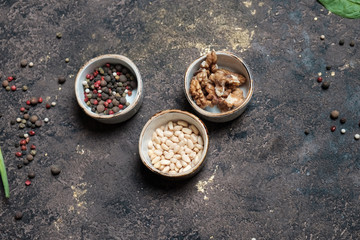 nuts, orange and cucumber in hand