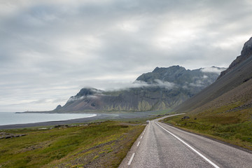 Empty asphalt road in high mountains along the coast