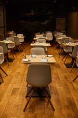 glasses near plates and tissues on wooden tables