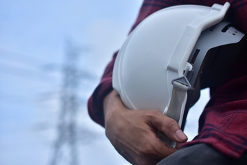 Engineering electrician hold white hard hat safety helmet